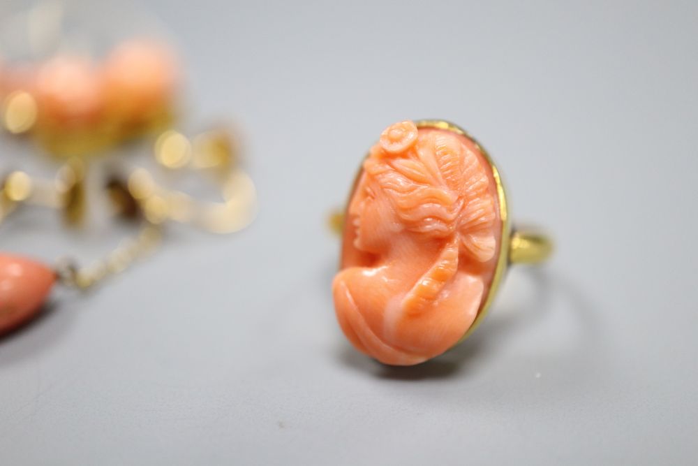 A triple strand coral bead bracelet, with coral set yellow metal clasp, 19.2cm, gross 20.5 grams, ring, earrings and bracelet a.f.